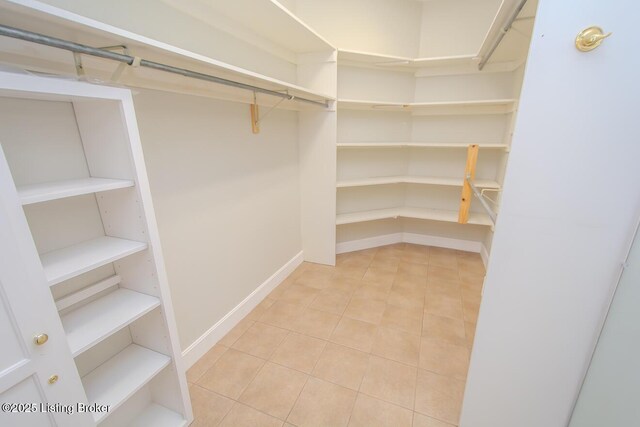 1038 Garden Creek Cir, Louisville, KY 40223 - walk in closet featuring light tile patterned flooring