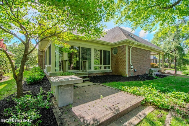 1038 Garden Creek Cir, Louisville, KY 40223 - rear view of property featuring brick siding, a patio area, and a shingled roof