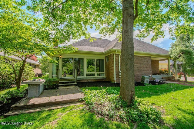 1038 Garden Creek Cir, Louisville, KY 40223 - back of property featuring a lawn, a shingled roof, and brick siding