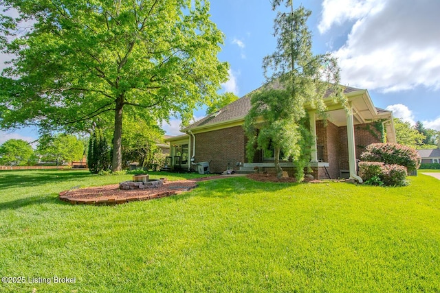 1038 Garden Creek Cir, Louisville, KY 40223 - view of home's exterior with brick siding, a yard, and a shingled roof