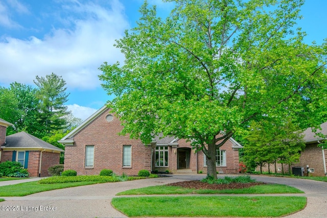 1038 Garden Creek Cir, Louisville, KY 40223 - view of front of property with curved driveway, brick siding, and central AC