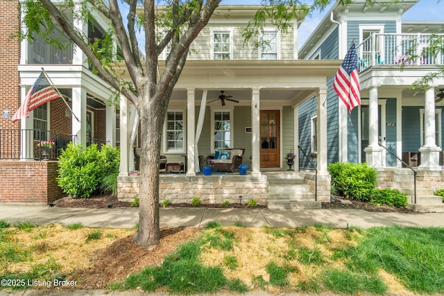 property entrance with ceiling fan and covered porch