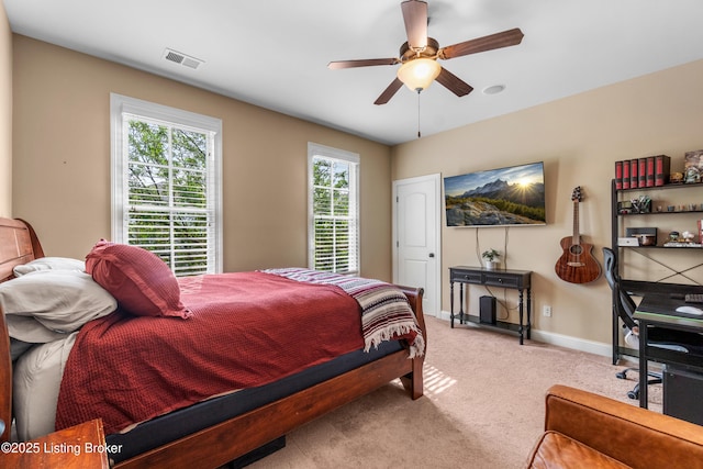 bedroom featuring baseboards, visible vents, ceiling fan, and carpet