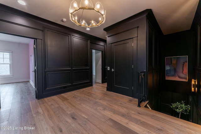 11004 Meeting St, Prospect, KY 40059 - interior space featuring a decorative wall, a chandelier, light wood-style floors, baseboards, and recessed lighting