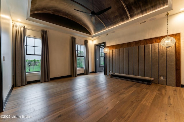 11004 Meeting St, Prospect, KY 40059 - spare room with ceiling fan, vaulted ceiling, a raised ceiling, wood-type flooring, and baseboards