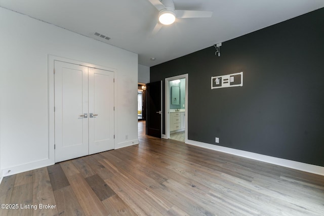 11004 Meeting St, Prospect, KY 40059 - unfurnished bedroom featuring wood finished floors, a closet, baseboards, and ensuite bathroom