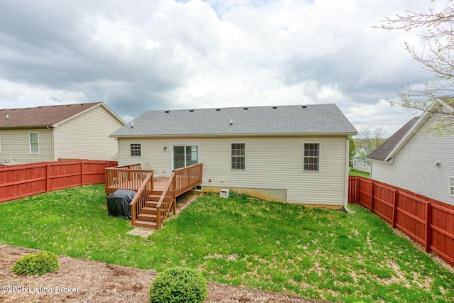 back of house featuring a wooden deck, a yard, a shingled roof, and a fenced backyard