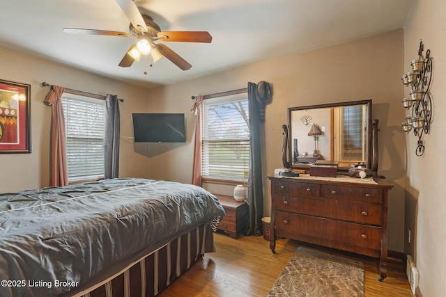 bedroom featuring a ceiling fan and wood finished floors