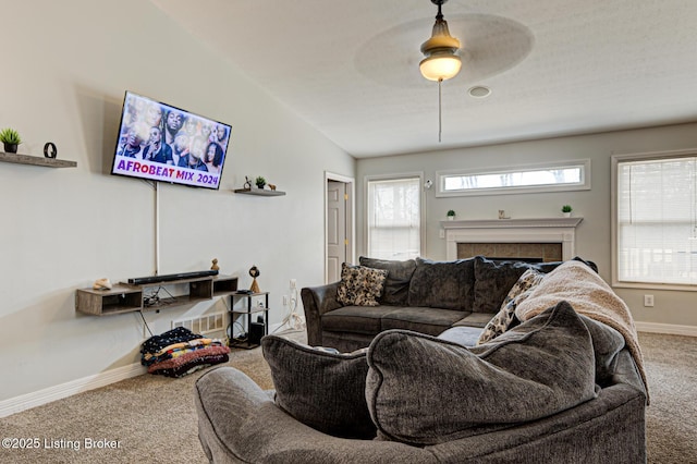 5416 Bannon Crossings Dr, Louisville, KY 40218 - living area featuring ceiling fan, baseboards, carpet flooring, and a tile fireplace