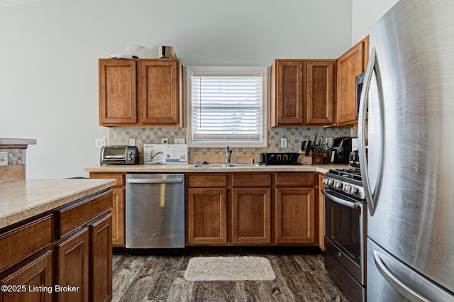 5416 Bannon Crossings Dr, Louisville, KY 40218 - kitchen with decorative backsplash, light countertops, a sink, and appliances with stainless steel finishes