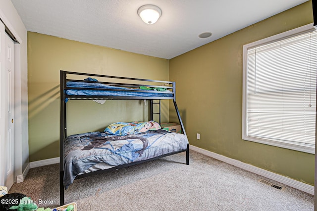 5416 Bannon Crossings Dr, Louisville, KY 40218 - bedroom with a closet, carpet floors, visible vents, and baseboards