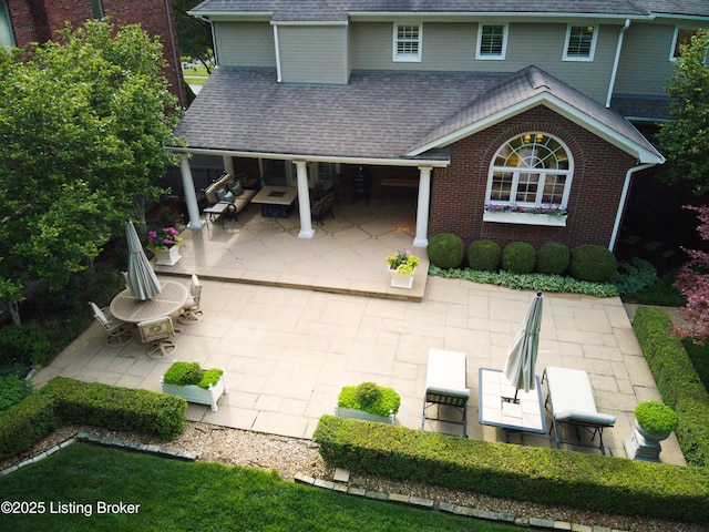 1304 Isleworth Dr, Louisville, KY 40245 - back of property featuring a patio area, roof with shingles, and brick siding