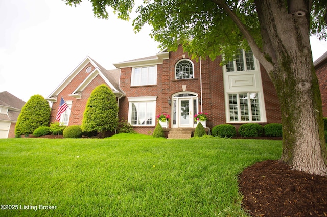 1304 Isleworth Dr, Louisville, KY 40245 - view of front of property featuring a front lawn and brick siding