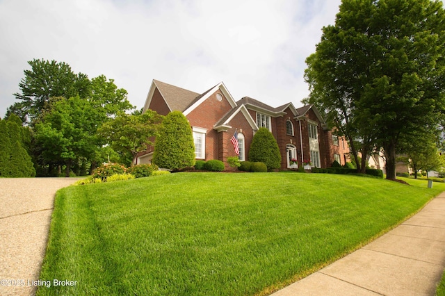 1304 Isleworth Dr, Louisville, KY 40245 - colonial house with brick siding and a front lawn
