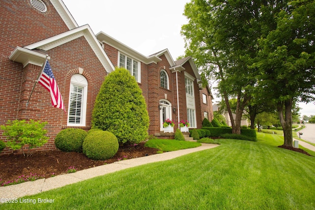 1304 Isleworth Dr, Louisville, KY 40245 - view of side of property with a lawn and brick siding