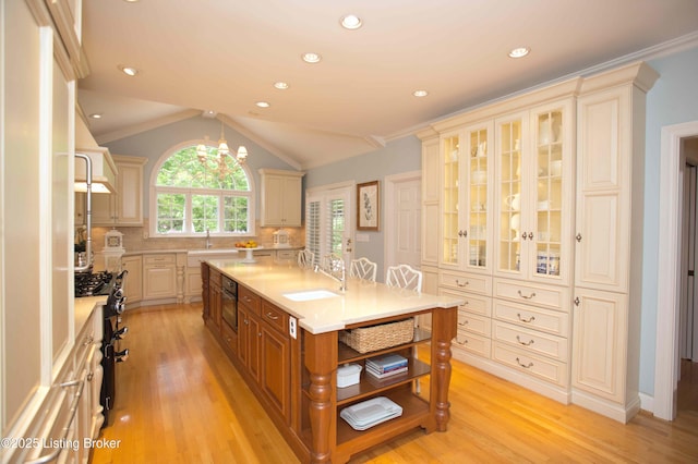1304 Isleworth Dr, Louisville, KY 40245 - kitchen with a sink, light countertops, light wood-style floors, cream cabinets, and recessed lighting
