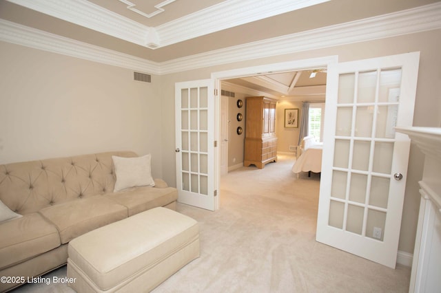 1304 Isleworth Dr, Louisville, KY 40245 - carpeted living area featuring crown molding, french doors, a raised ceiling, and baseboards