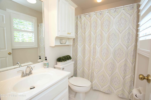 1304 Isleworth Dr, Louisville, KY 40245 - full bathroom with healthy amount of natural light, vanity, toilet, and tile patterned floors