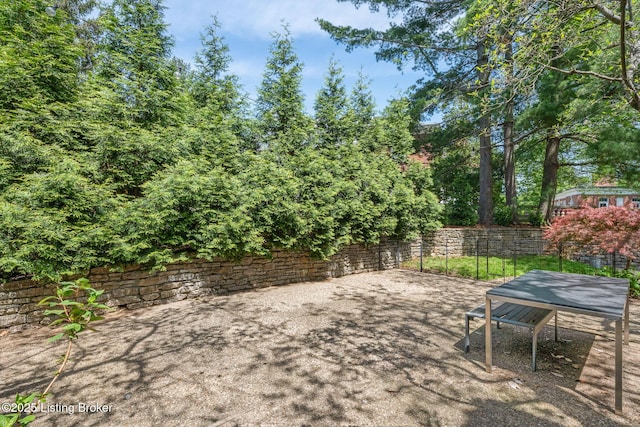 view of patio / terrace featuring fence