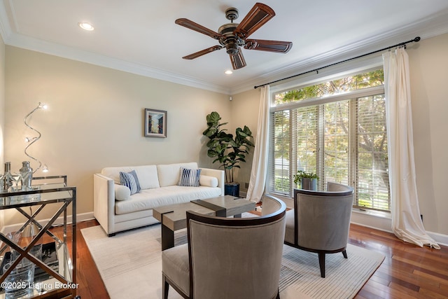 living room with crown molding, ceiling fan, hardwood / wood-style floors, baseboards, and recessed lighting