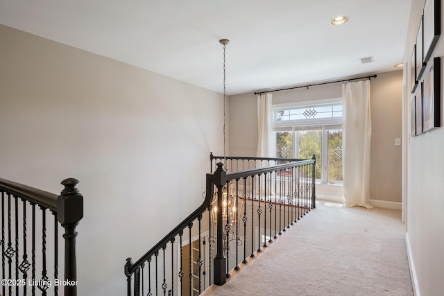 stairway with carpet flooring, recessed lighting, visible vents, and baseboards