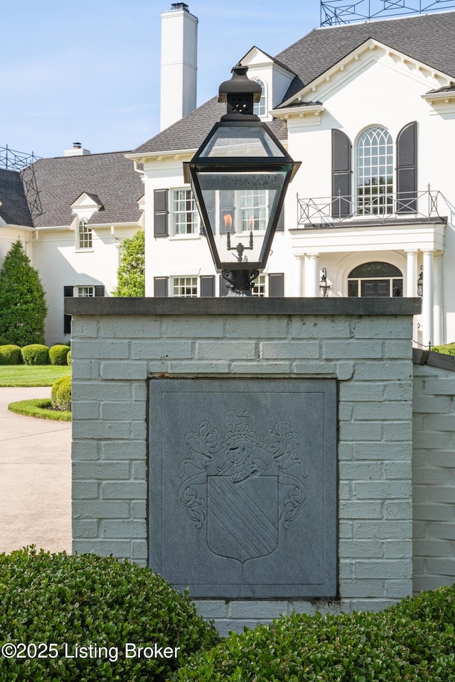 exterior view of a chimney and roof with shingles