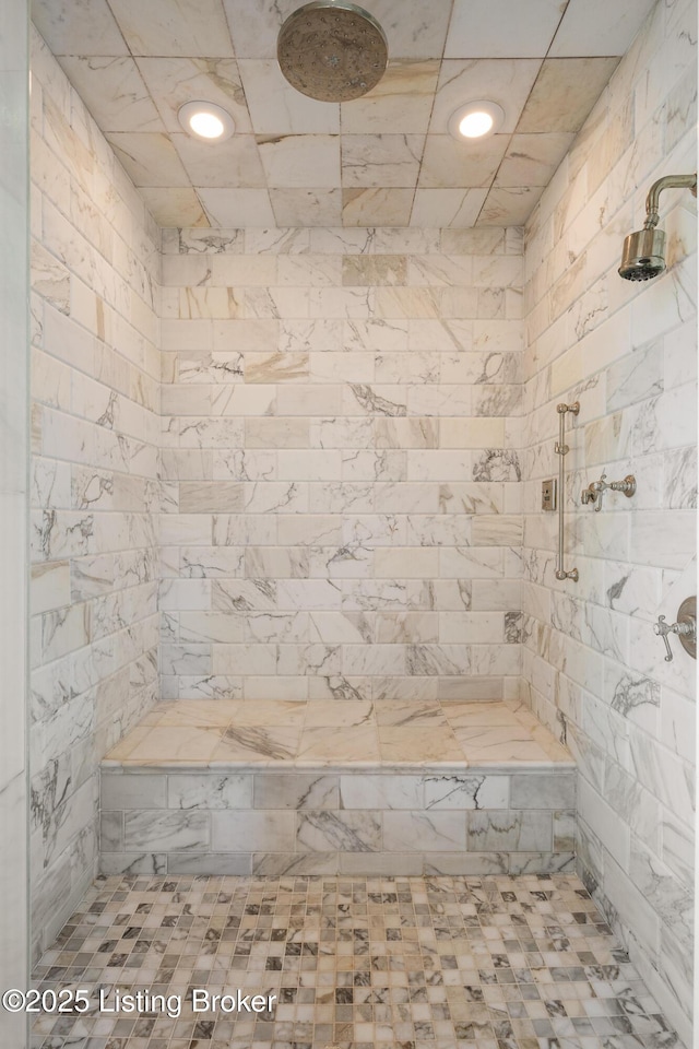 bathroom with a tile shower