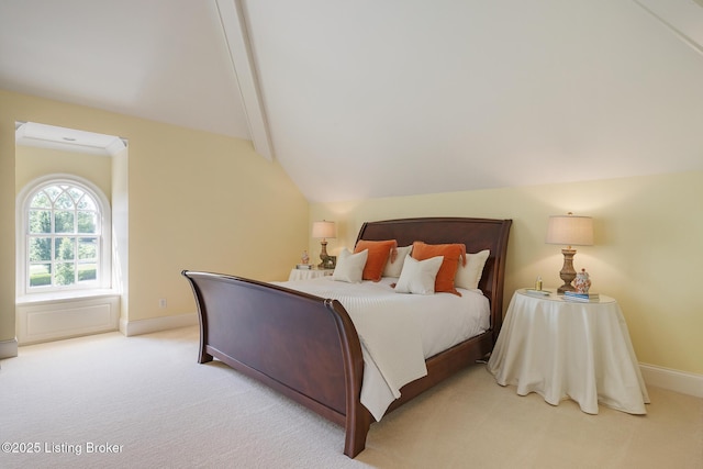 bedroom featuring baseboards and light carpet