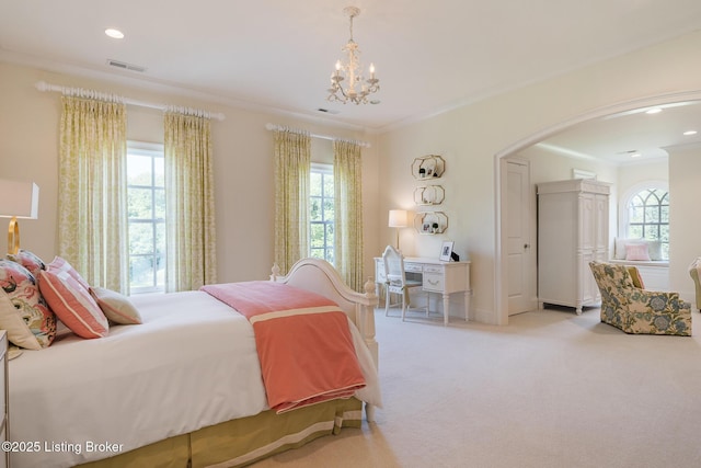 bedroom featuring arched walkways, carpet floors, a chandelier, ornamental molding, and recessed lighting