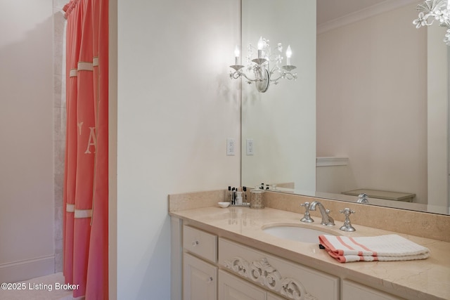 bathroom featuring vanity and a chandelier