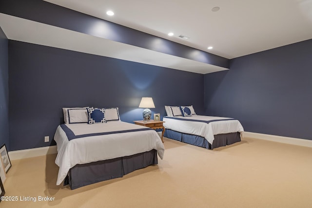 carpeted bedroom featuring baseboards and recessed lighting