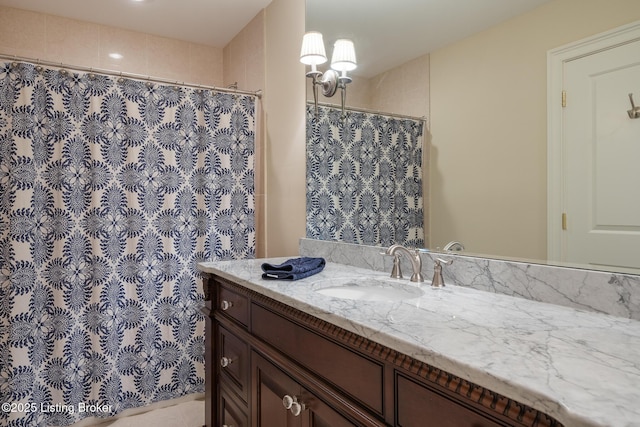 bathroom featuring vanity and a shower with shower curtain