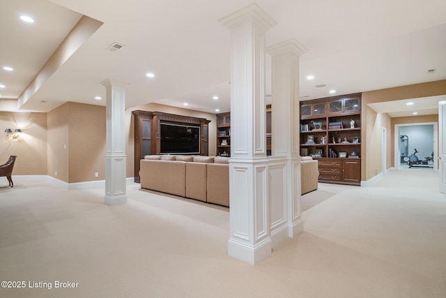 unfurnished living room with decorative columns, light colored carpet, recessed lighting, and built in shelves