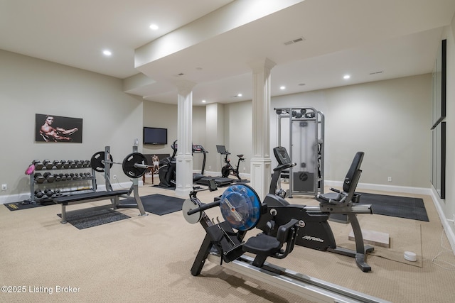 workout area featuring ornate columns, carpet floors, and recessed lighting