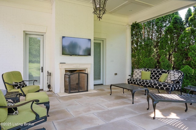 view of patio / terrace featuring an outdoor living space with a fireplace