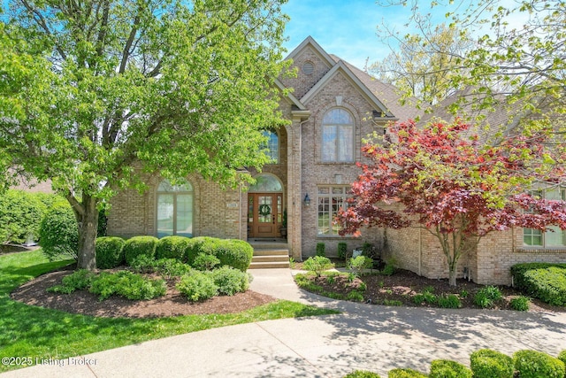 traditional-style home featuring brick siding