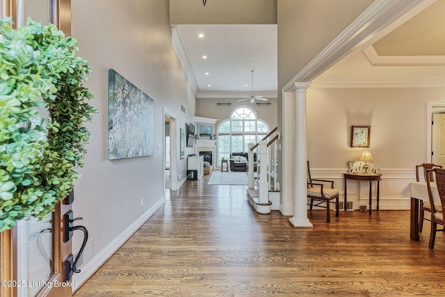 foyer entrance featuring recessed lighting, wood finished floors, stairs, decorative columns, and ceiling fan