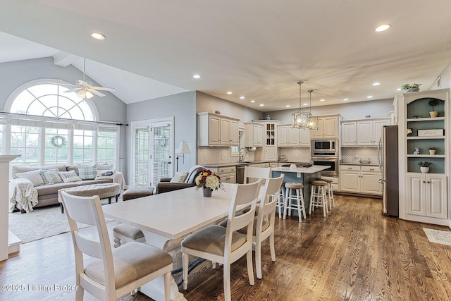 dining room with dark wood-type flooring, ceiling fan, lofted ceiling with beams, and recessed lighting