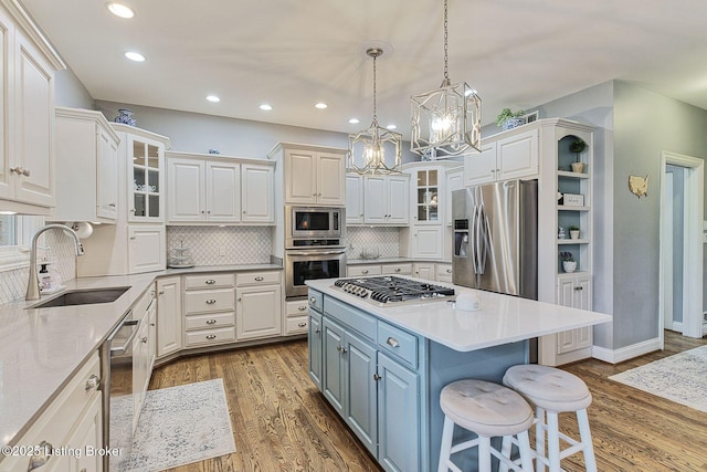 kitchen featuring white cabinetry, recessed lighting, stainless steel appliances, and a sink