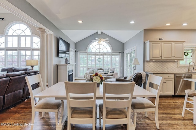 dining area with recessed lighting, a fireplace, dark wood-style floors, a ceiling fan, and lofted ceiling
