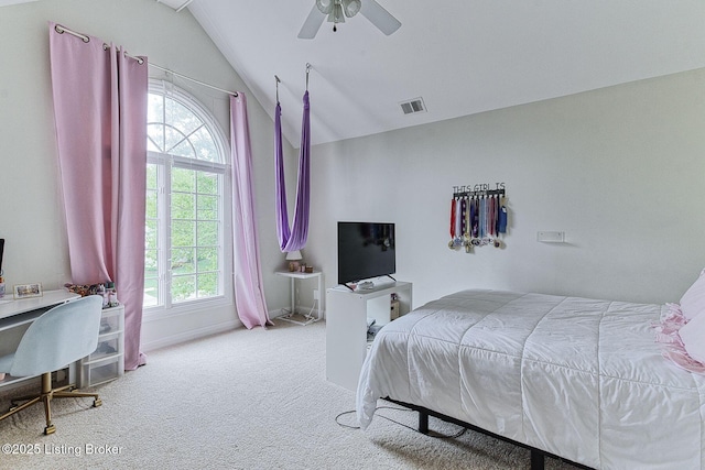 bedroom with carpet floors, visible vents, vaulted ceiling, and multiple windows