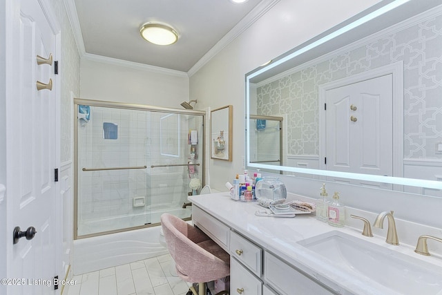 full bath with enclosed tub / shower combo, vanity, ornamental molding, and wallpapered walls