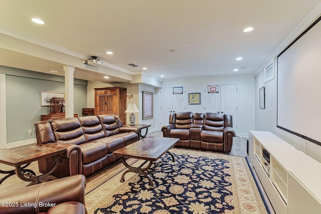 living area featuring recessed lighting, ornate columns, baseboards, visible vents, and crown molding