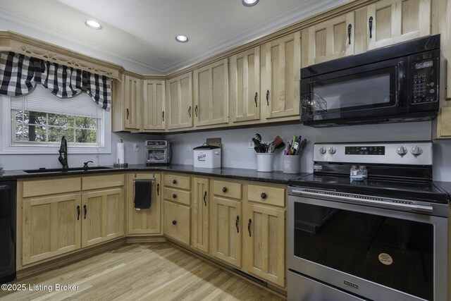 kitchen featuring recessed lighting, a sink, light wood-style floors, black microwave, and electric range