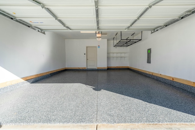 3611 Fordham Pk Dr, Louisville, KY 40245 - garage featuring baseboards, electric panel, and a garage door opener