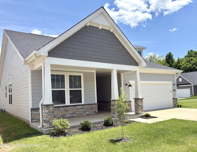 3611 Fordham Pk Dr, Louisville, KY 40245 - craftsman house featuring covered porch, stone siding, an attached garage, and driveway