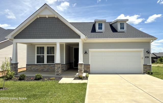 3611 Fordham Pk Dr, Louisville, KY 40245 - craftsman house featuring covered porch, stone siding, and driveway