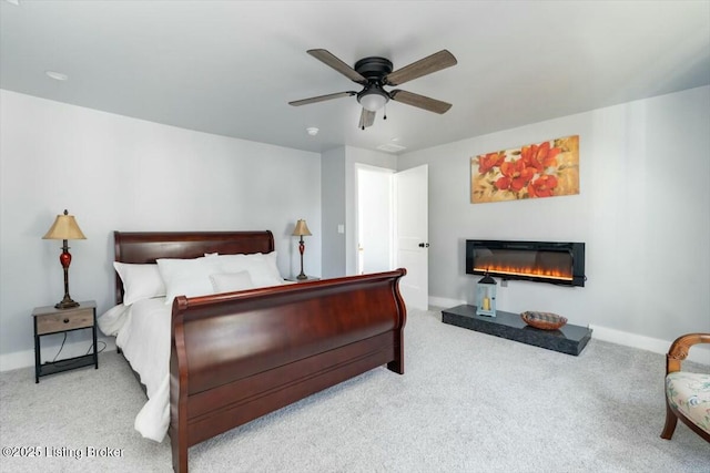306 E Washington St, La Grange, KY 40031 - bedroom featuring baseboards, a glass covered fireplace, carpet, and ceiling fan