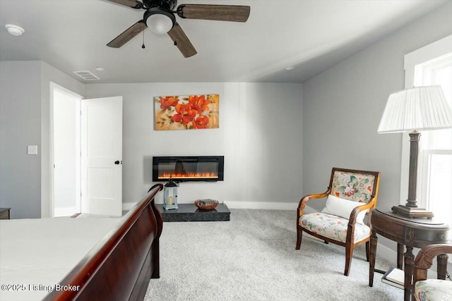 306 E Washington St, La Grange, KY 40031 - bedroom featuring a glass covered fireplace, ceiling fan, baseboards, carpet flooring, and visible vents