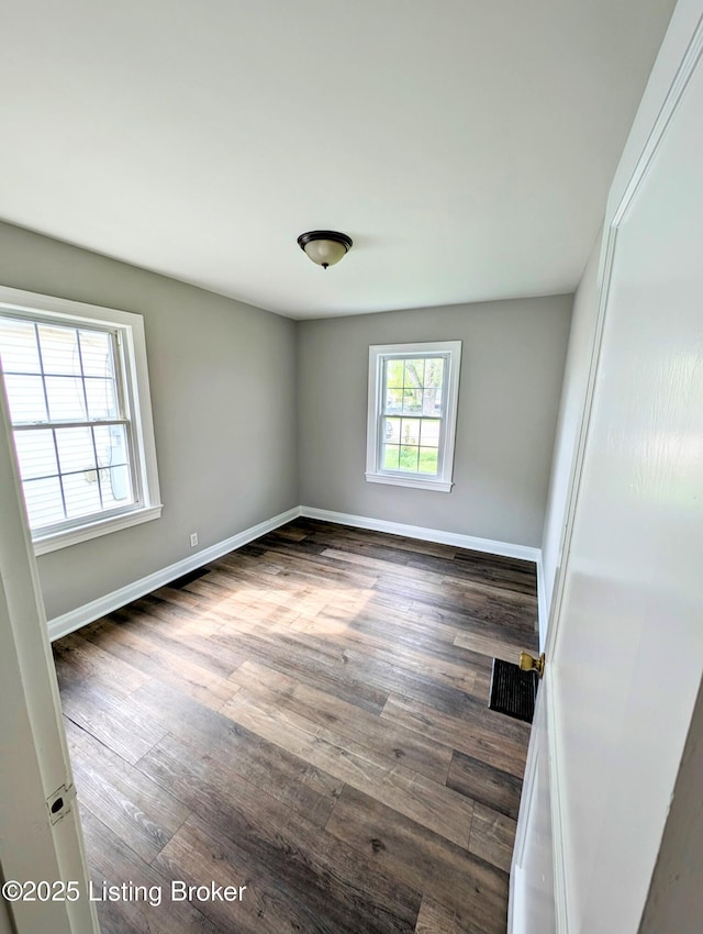 1104 Oleanda Ave, Louisville, KY 40215 - unfurnished room featuring wood finished floors and baseboards